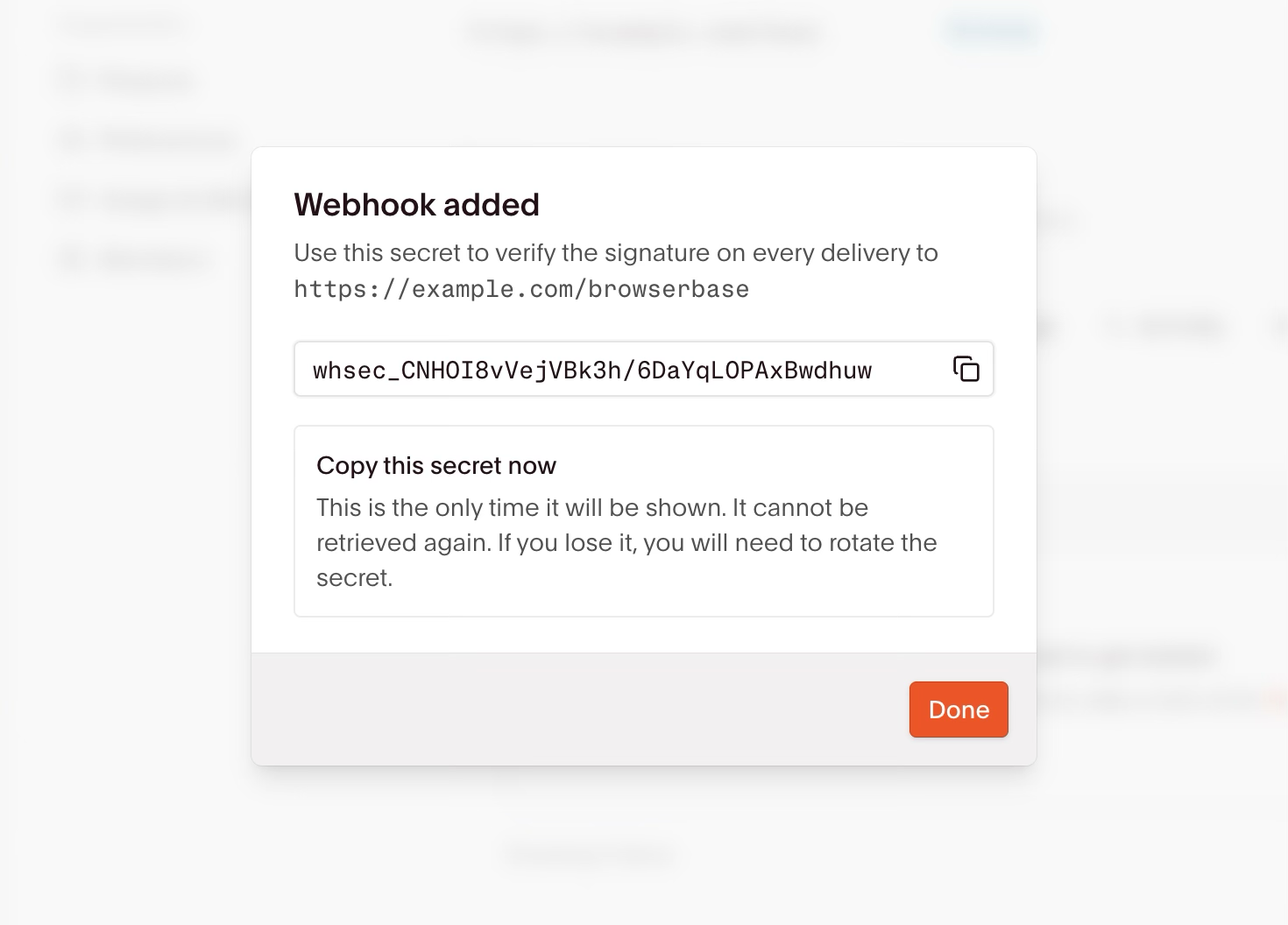 A confirmation dialog showing the signing secret for a newly created webhook, warning that it appears only once
