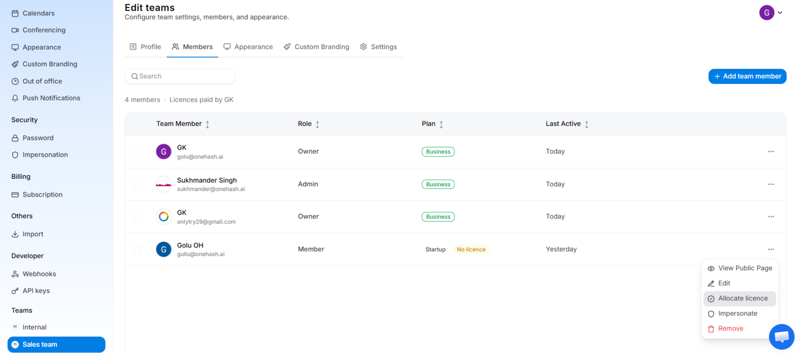 Team Members list with the three-dot menu open on a member, showing the license assignment and Revoke License options