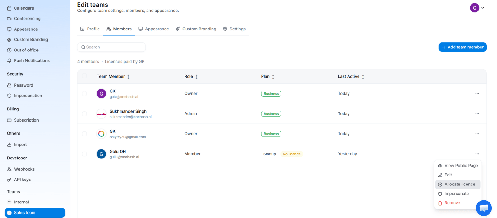 Team Members list with the three-dot menu open on a member, showing the license assignment and Revoke License options