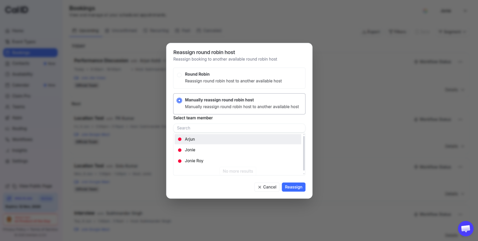 Select team member search field open in the reassign dialog, listing the event's other assigned hosts with their avatars and names