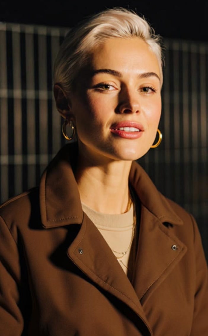 Captions Mirage AI actor new look variant showing the same actor wearing a chocolate brown winter coat