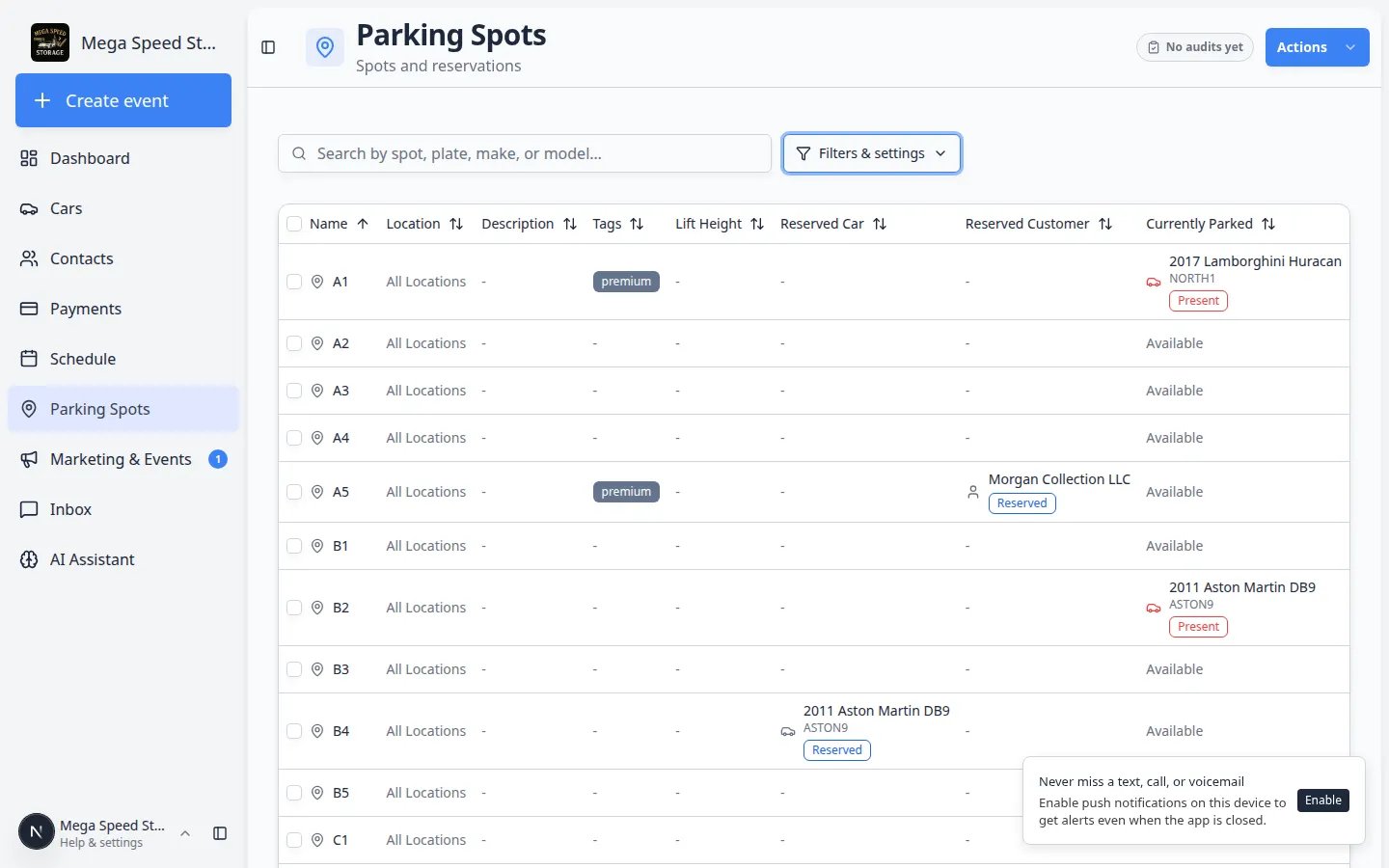Parking Spots table view listing spot names, reserved customers, currently parked vehicles, and status
