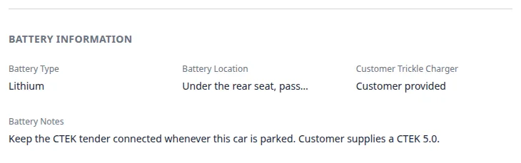 Battery Information section on a car record showing Lithium battery type, rear-seat location, customer-provided trickle charger, and tender notes