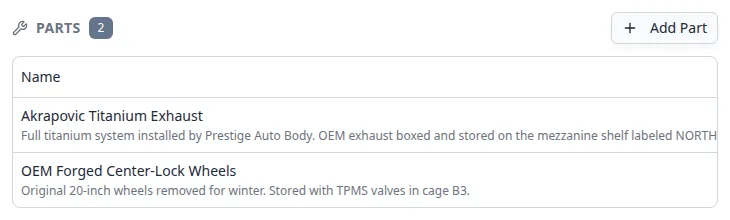 Parts section showing two entries: Akrapovic Titanium Exhaust and OEM Forged Center-Lock Wheels with storage notes