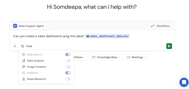 Chat message requesting a sales dashboard with data file attached and Artifacts enabled in Tools