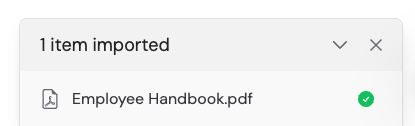 Upload confirmation showing Employee Handbook.pdf successfully imported