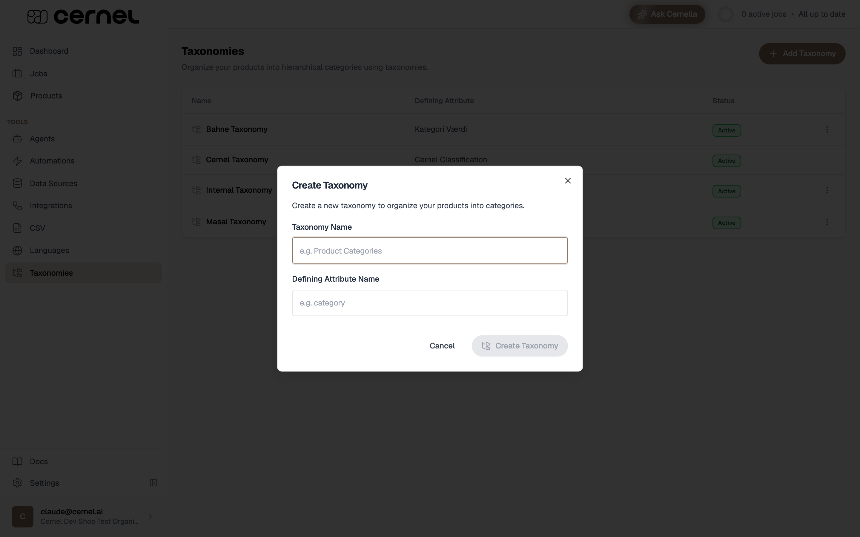 The Create Taxonomy dialog with a Taxonomy Name field (placeholder 'e.g. Product Categories') and a Defining Attribute Name field (placeholder 'e.g. category'), with Cancel and Create Taxonomy buttons