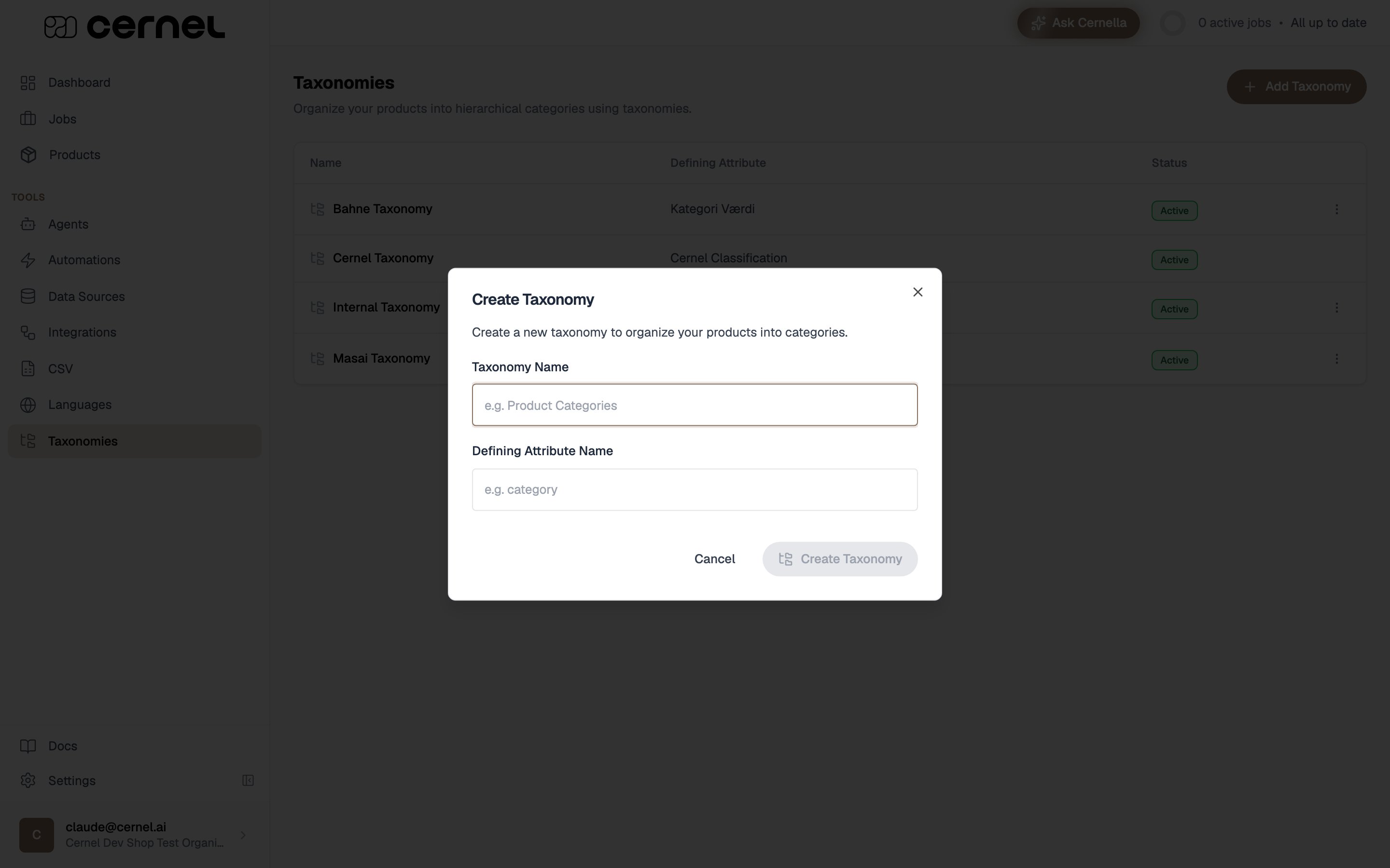 The Create Taxonomy dialog with a Taxonomy Name field (placeholder 'e.g. Product Categories') and a Defining Attribute Name field (placeholder 'e.g. category'), with Cancel and Create Taxonomy buttons