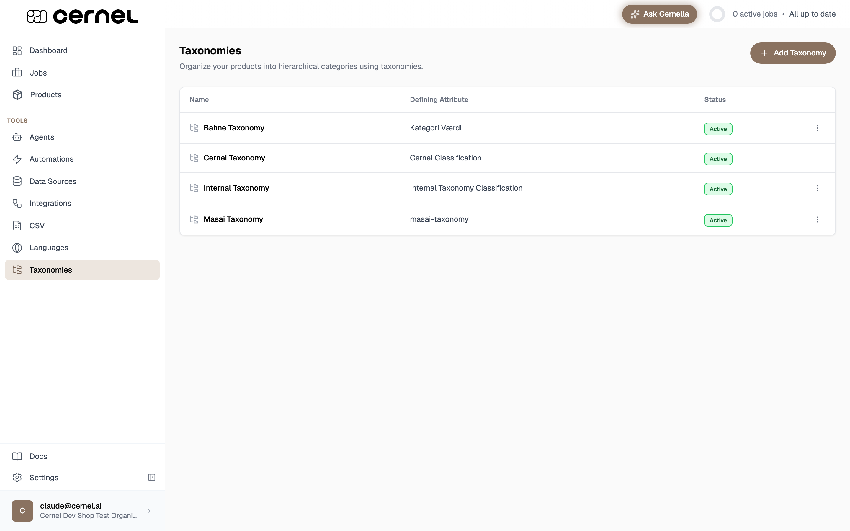 The Taxonomies page listing four taxonomies (Bahne, Cernel, Internal, and Masai) in a table with Name, Defining Attribute, and Status columns, all marked Active, with an Add Taxonomy button in the top right