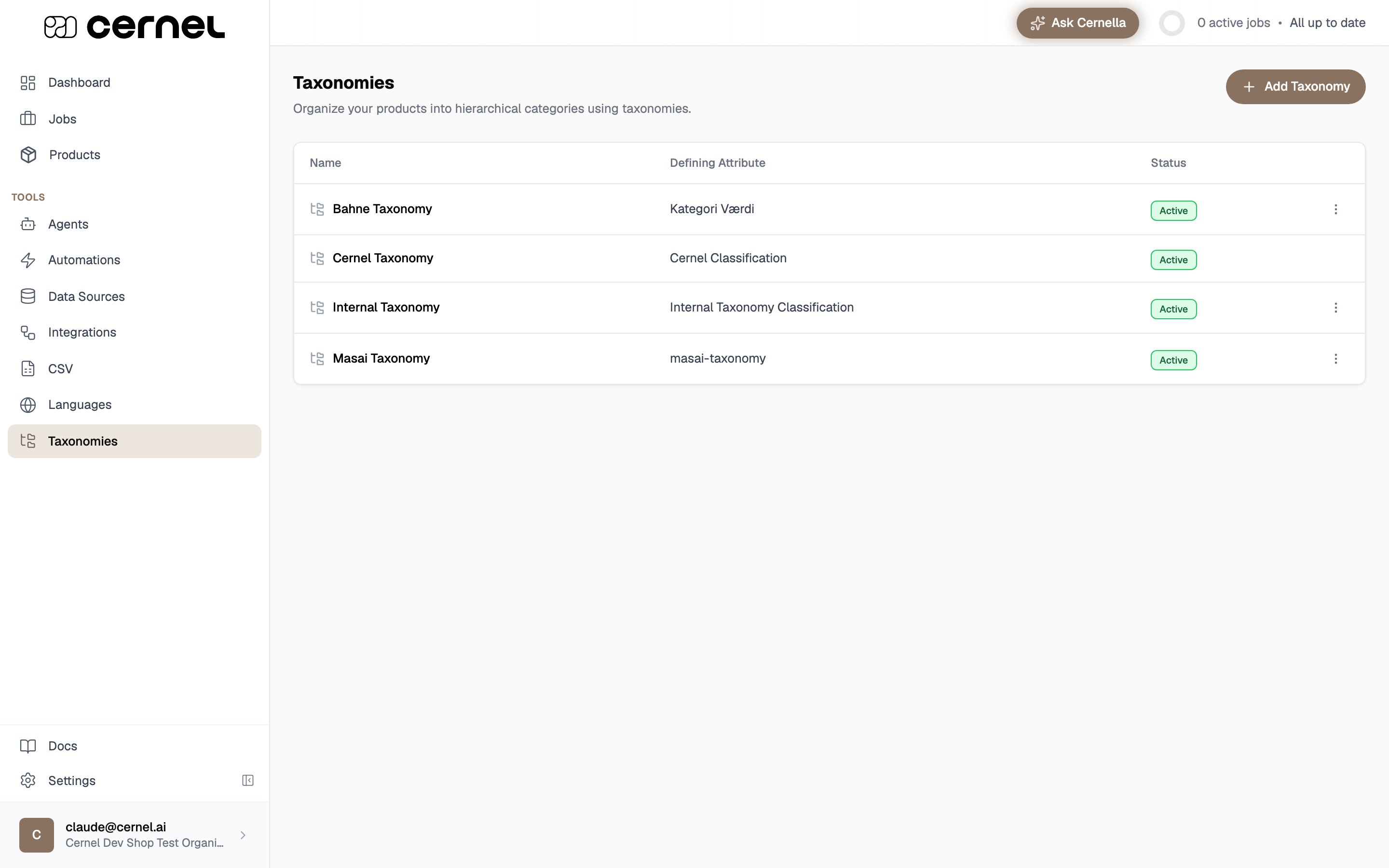 The Taxonomies page listing four taxonomies (Bahne, Cernel, Internal, and Masai) in a table with Name, Defining Attribute, and Status columns, all marked Active, with an Add Taxonomy button in the top right