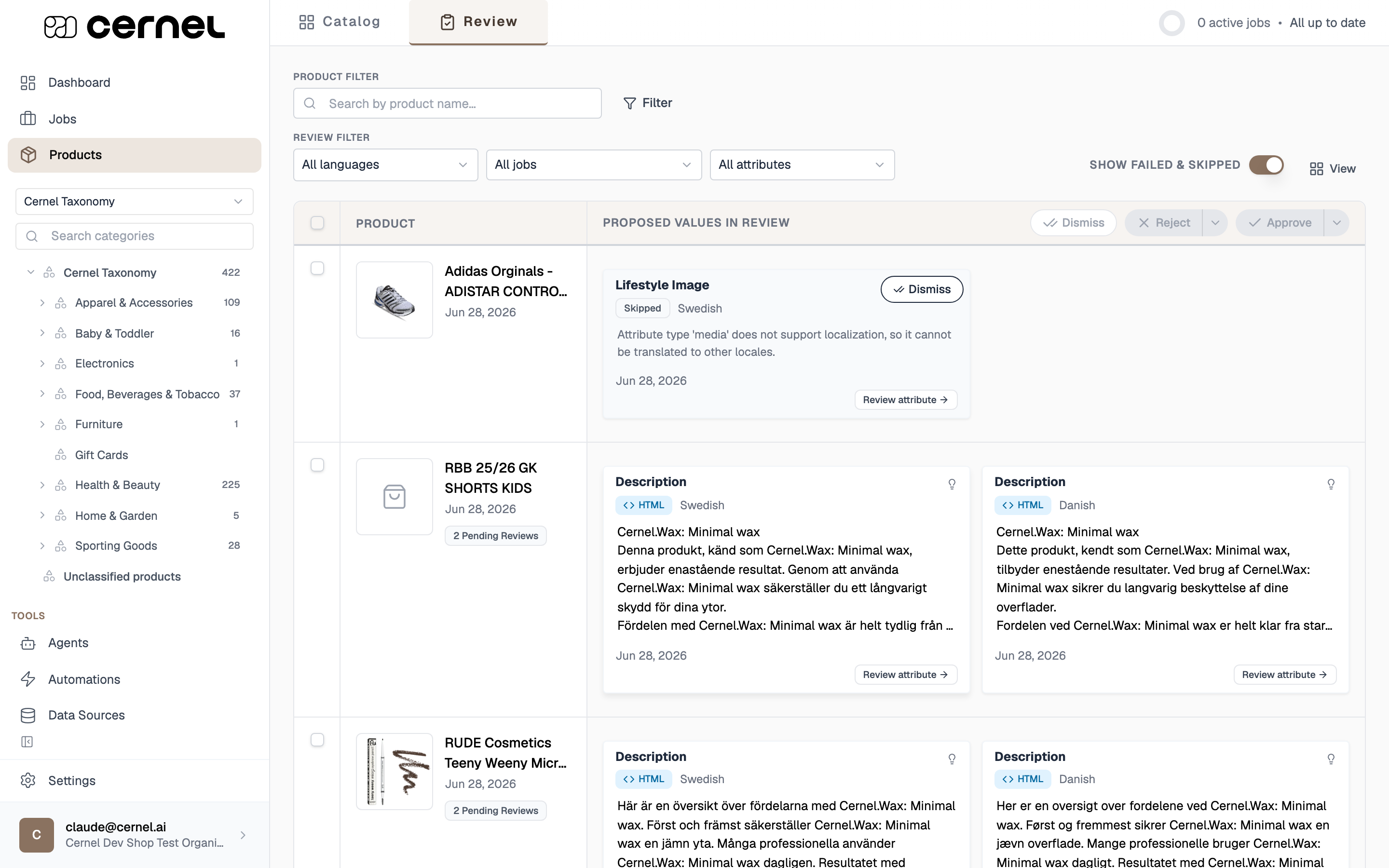 The Review surface: the Catalog / Review switcher at the top, the product and review filters (languages, jobs, attributes, and a Show failed & skipped toggle), and the queue listing products with their proposed-value cards and bulk Dismiss, Reject, and Approve actions