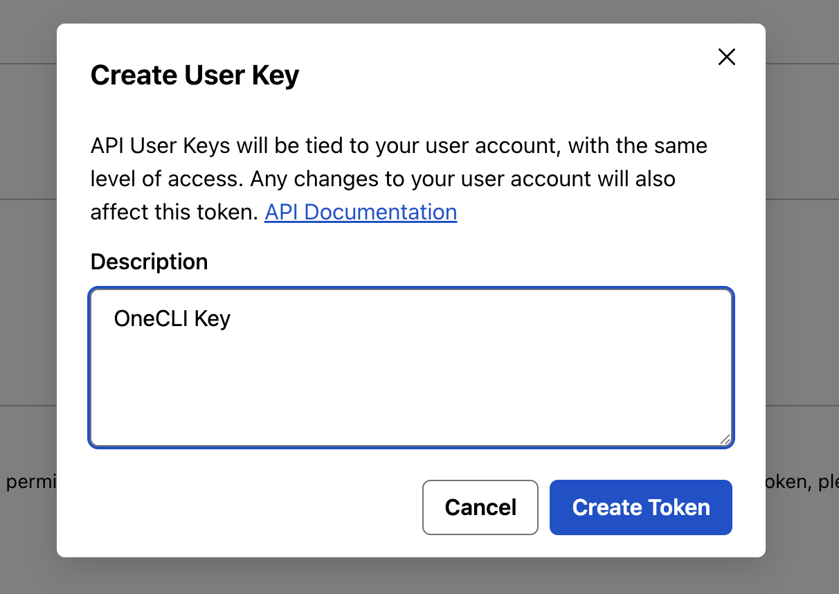 PagerDuty Create User Key dialog, explaining that API user keys are tied to your user account with the same level of access, a Description field filled with OneCLI Key, and Cancel and Create Token buttons.