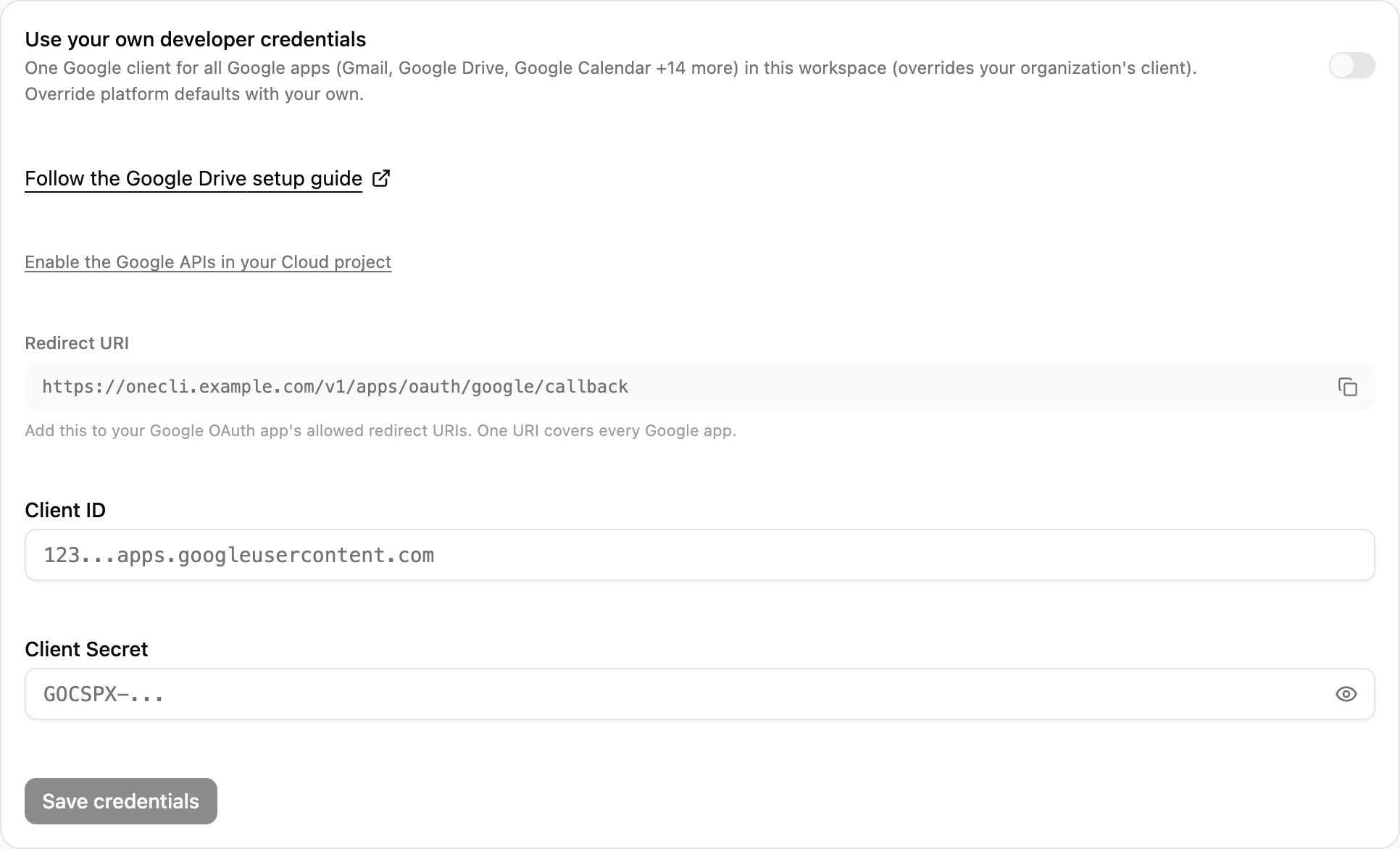 OneCLI Custom credentials card for Google Drive with the setup guide link, the Redirect URI and its copy button, and the Client ID and Client Secret fields.