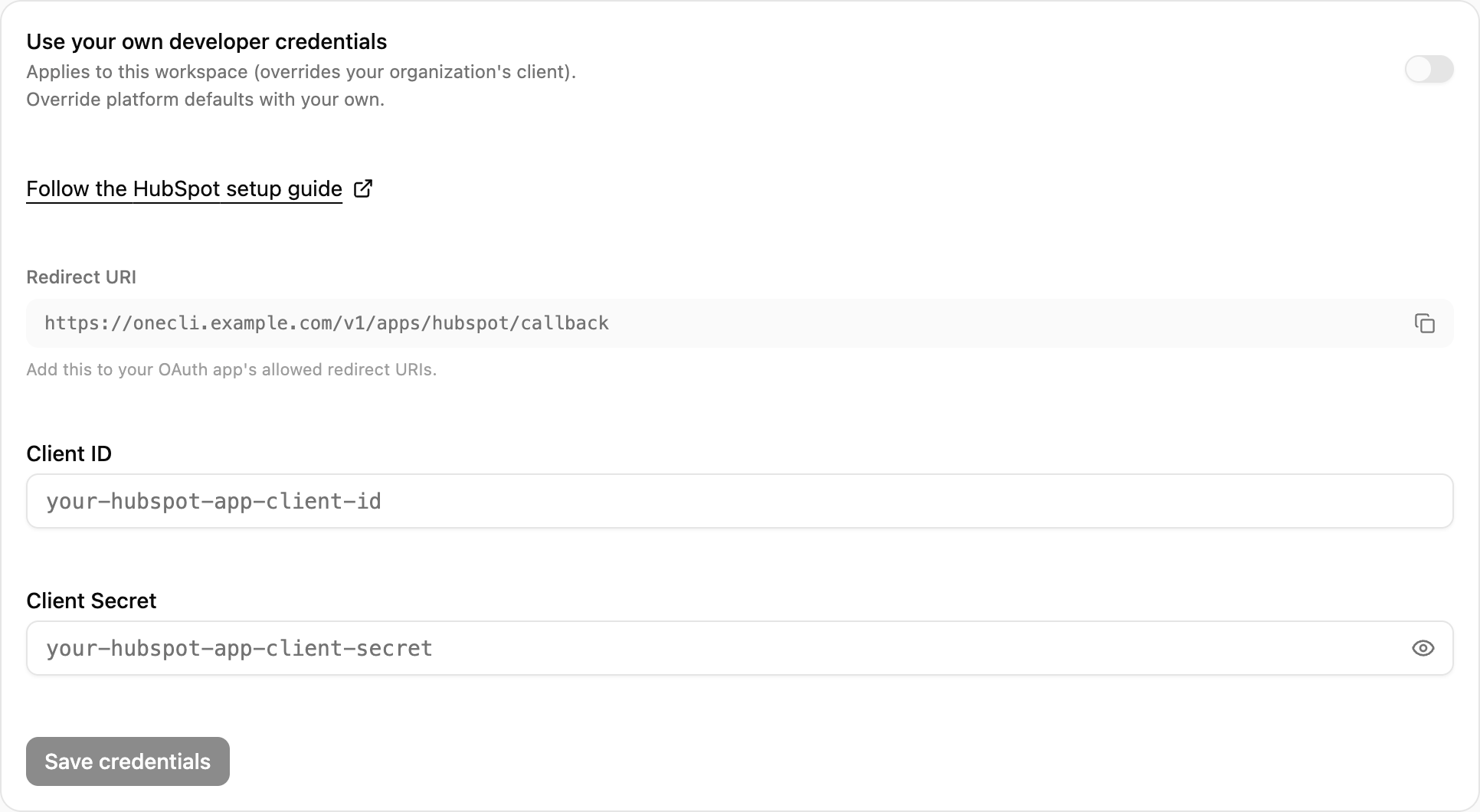OneCLI Custom credentials card for HubSpot with the setup guide link, the Redirect URI and its copy button, and the client ID and secret fields.