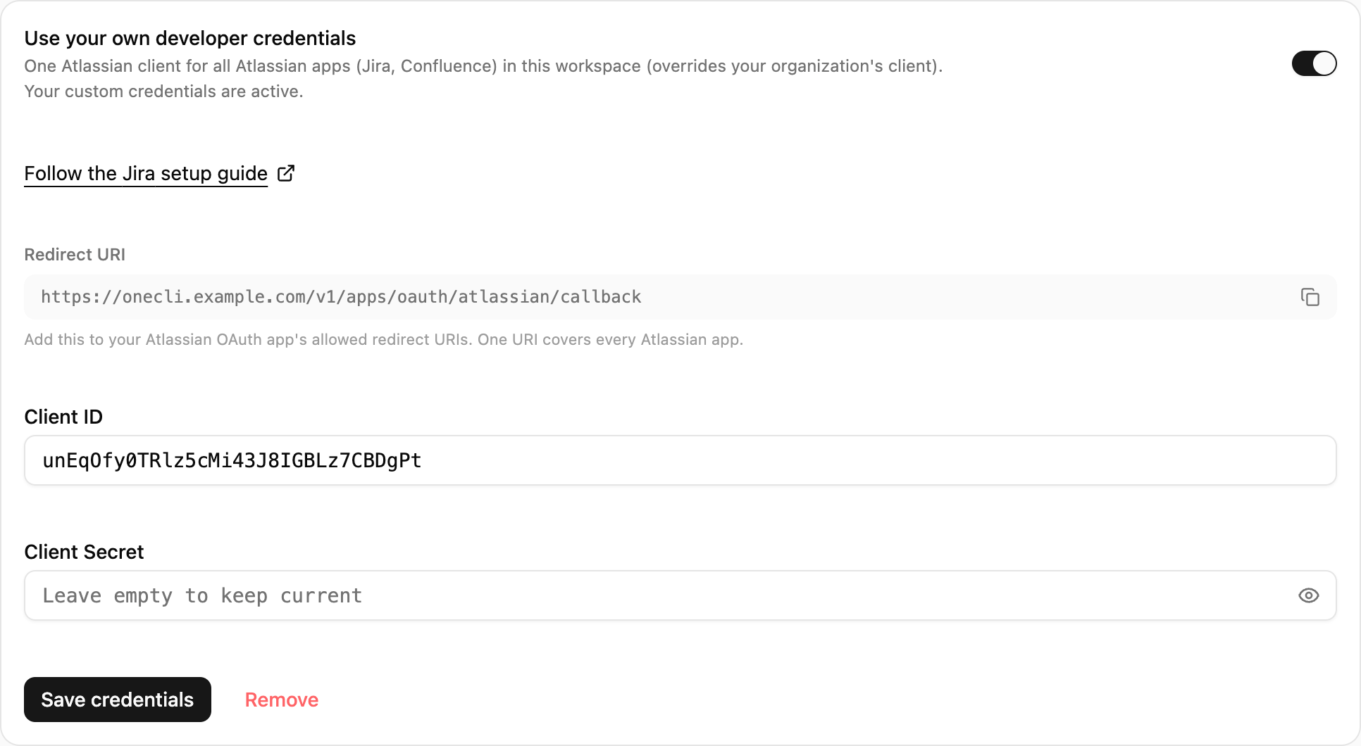 OneCLI Custom credentials card for Jira with the setup guide link, the Redirect URI and its copy button, and the client ID and secret fields.