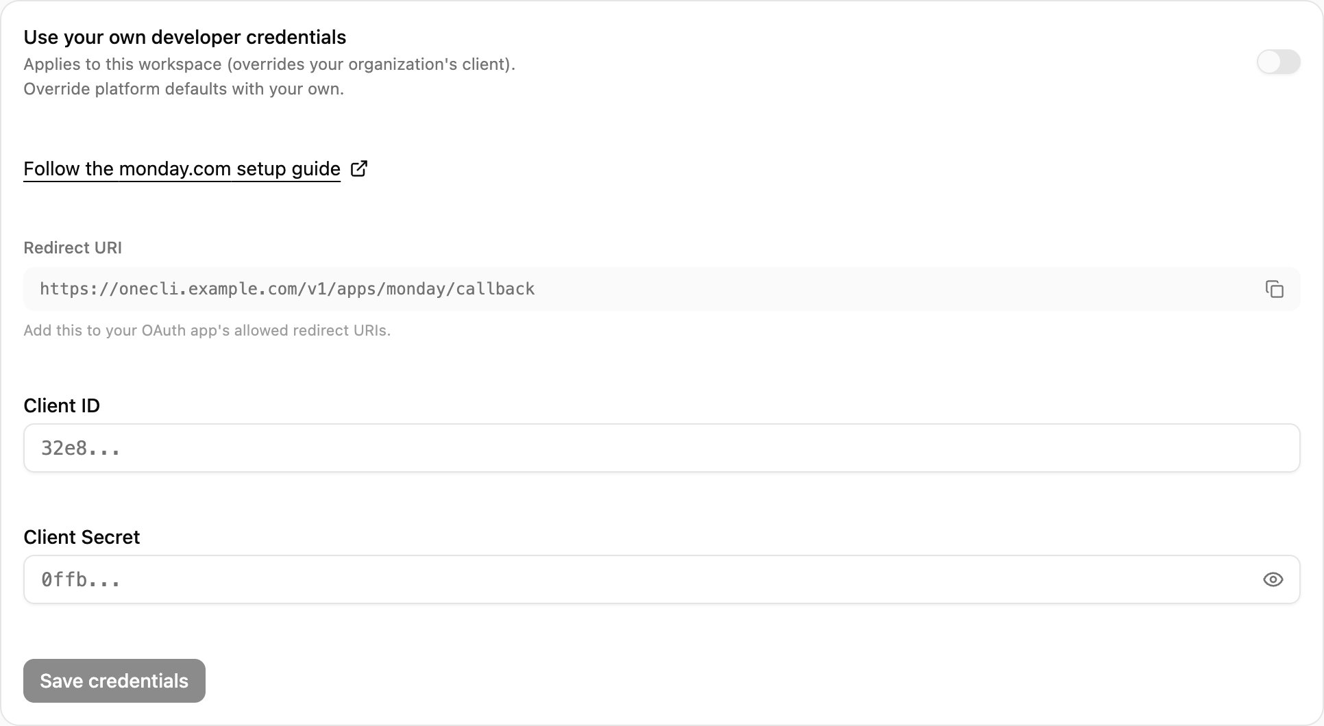 OneCLI Custom credentials card for monday.com with the setup guide link, the Redirect URI and its copy button, and the client ID and secret fields.