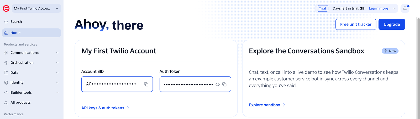 Twilio Console home page showing the account card with a masked Account SID, a hidden Auth Token, and the API keys & auth tokens link.