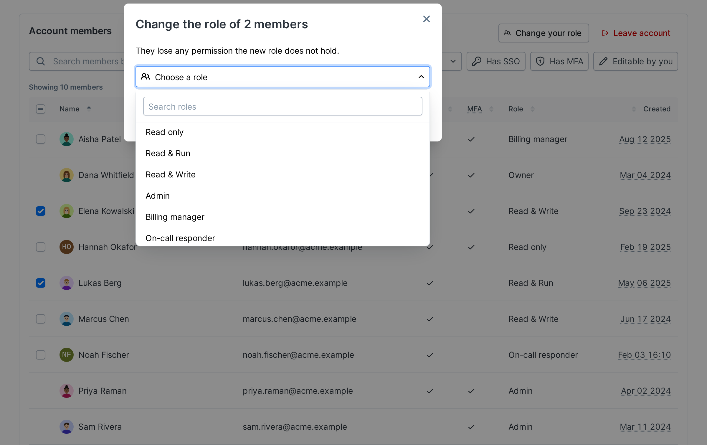 The Change role dialog with the role picker open, listing the built-in roles and then the custom roles Billing manager and On-call responder