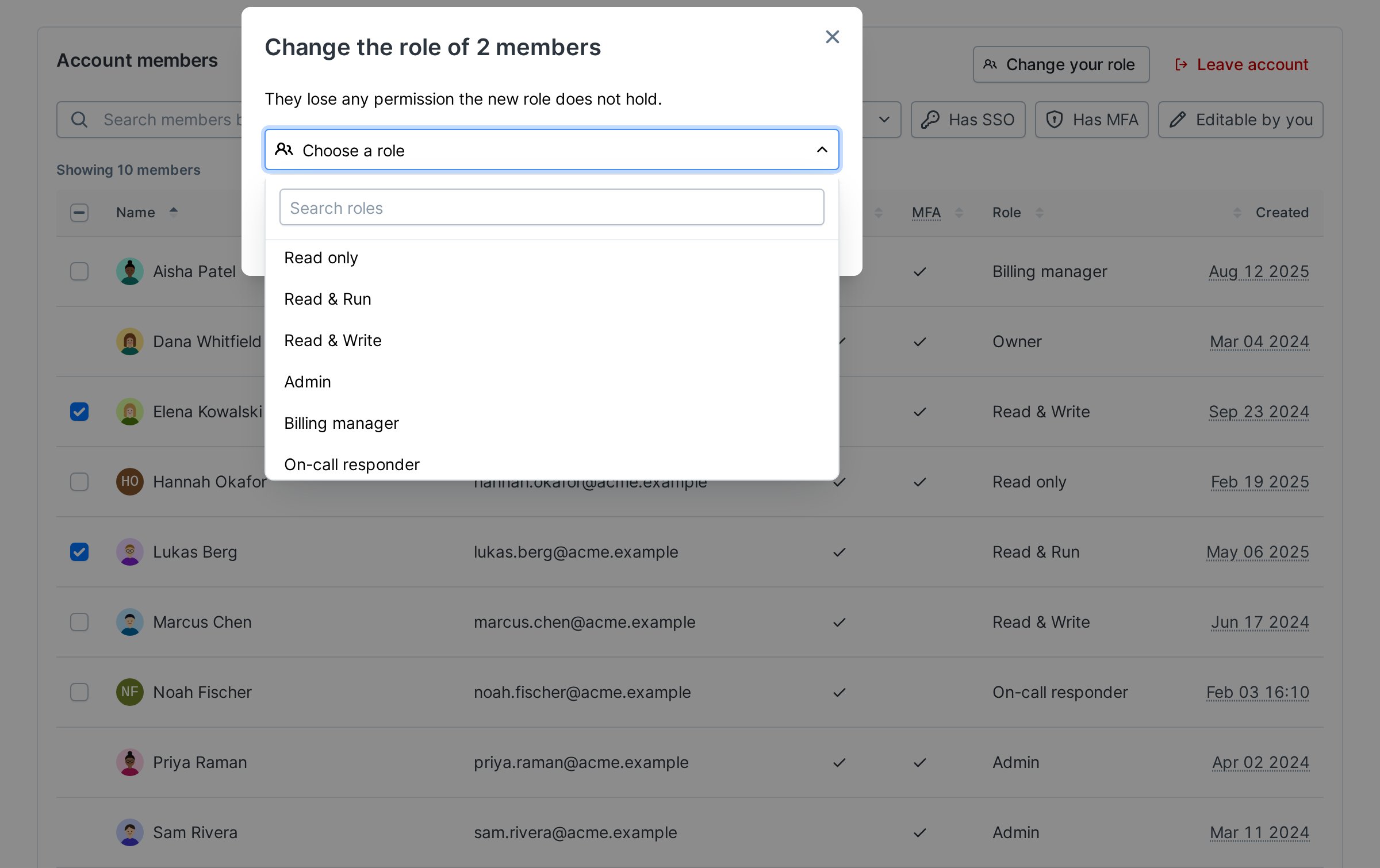 The Change role dialog with the role picker open, listing the built-in roles and then the custom roles Billing manager and On-call responder