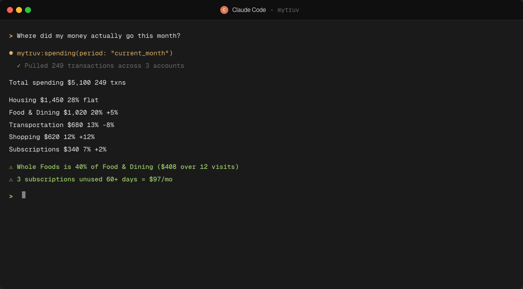 Claude Code session calling mytruv:spending and rendering a categorized monthly breakdown in the terminal