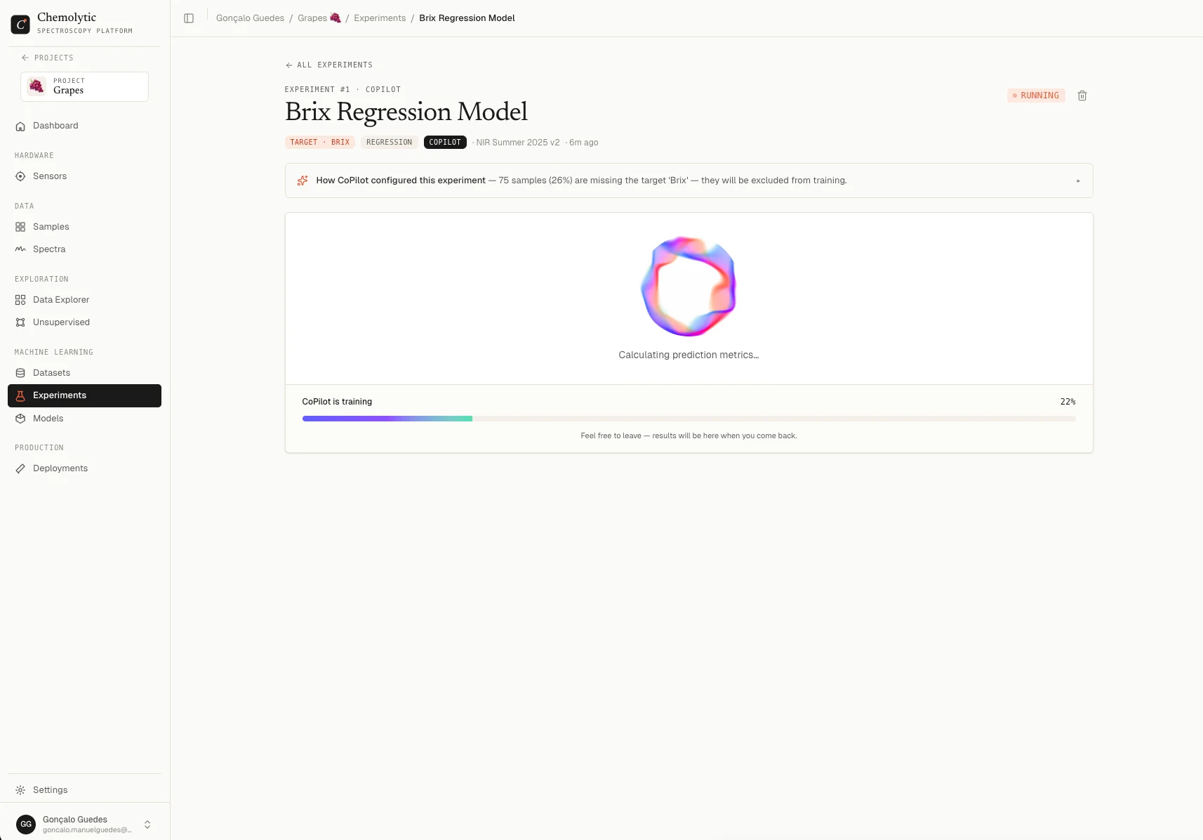 Experiment detail page while running, showing progress bar and list of trials