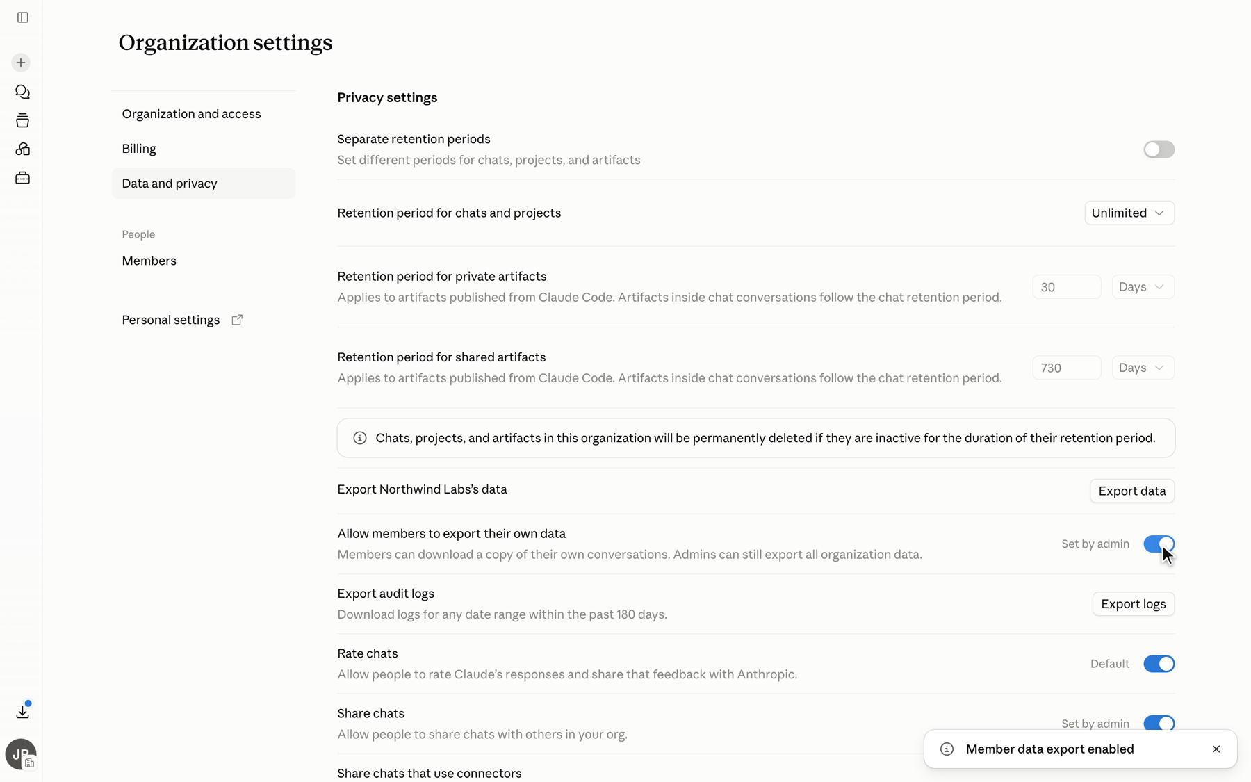 claude.ai organization settings, Data and privacy page, with the Allow members to export their own data toggle turned on and a confirmation toast reading Member data export enabled.