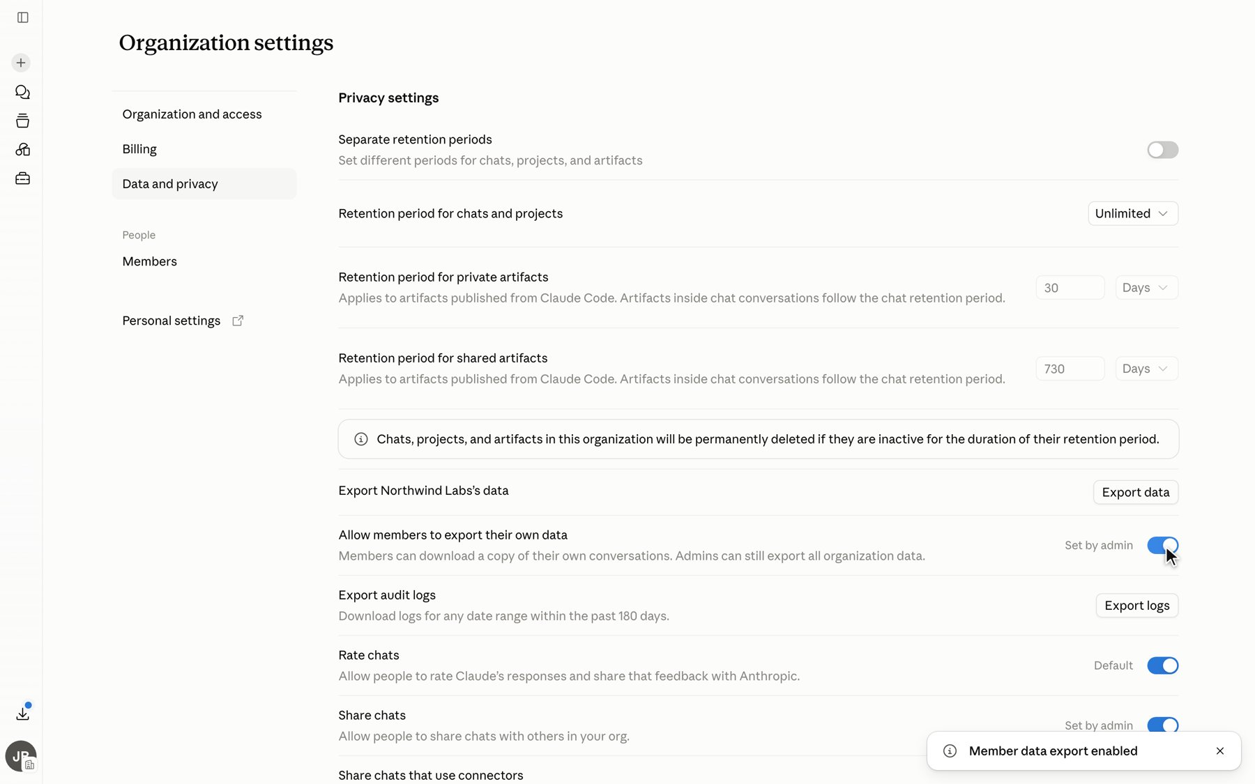 claude.ai organization settings, Data and privacy page, with the Allow members to export their own data toggle turned on and a confirmation toast reading Member data export enabled.