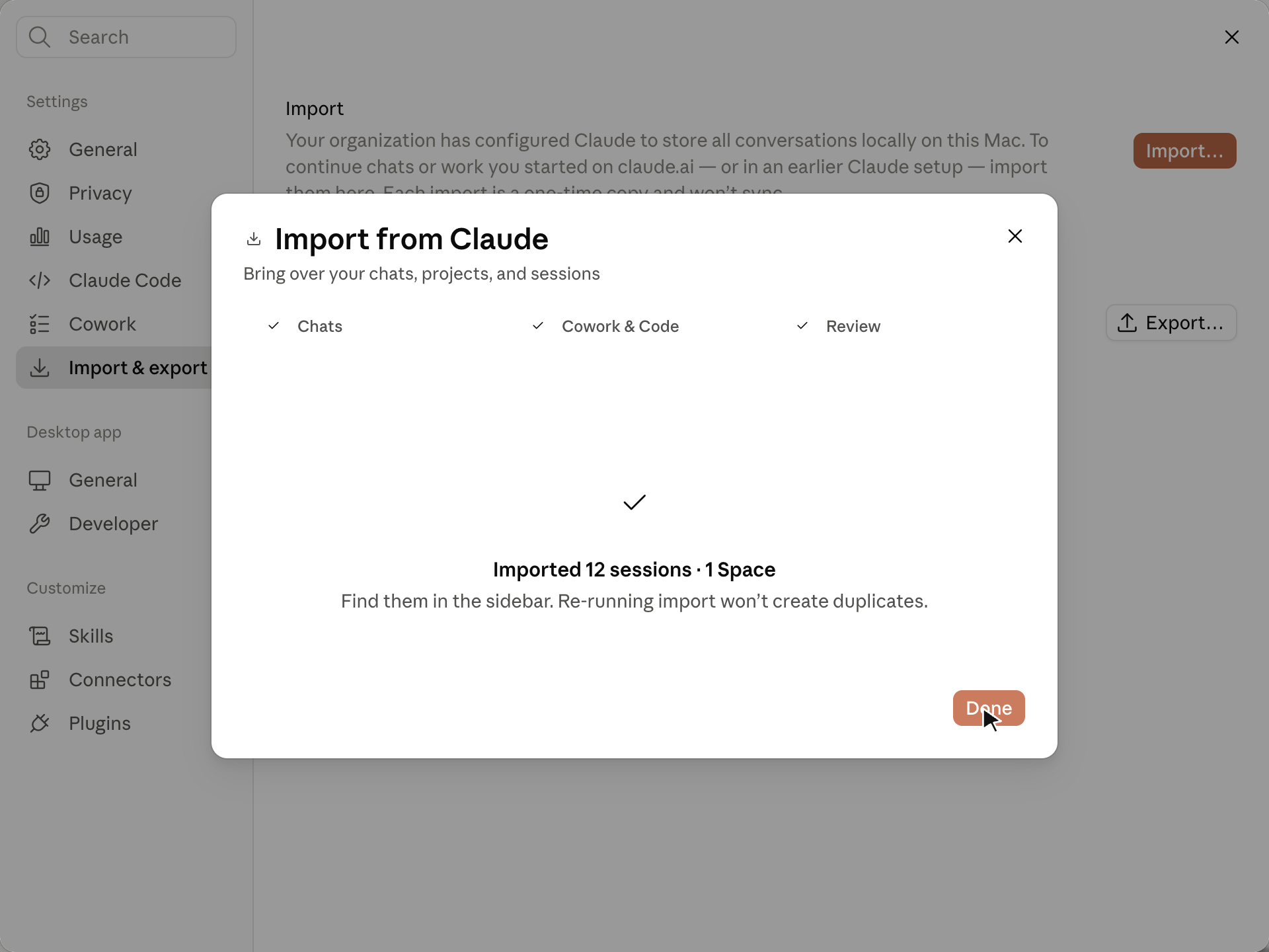 Import from Claude wizard success screen reading Imported 12 sessions and 1 Space, with a note that re-running import will not create duplicates.
