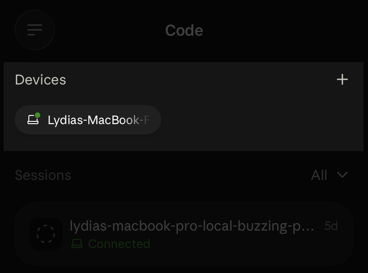 The Code tab in the Claude mobile app with a Devices section showing a connected MacBook as a device card above the sessions list