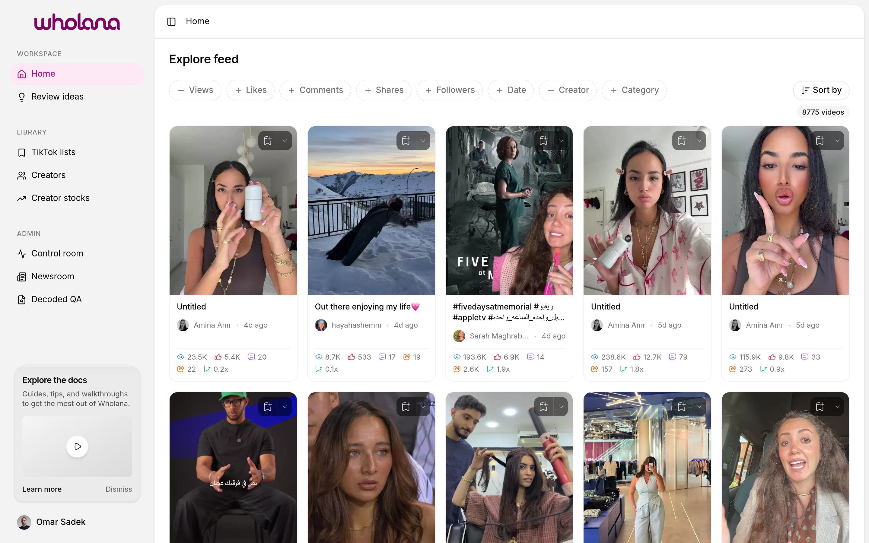 The Wholana Explore feed — filter chips, sort, and a grid of video cards with outlier scores