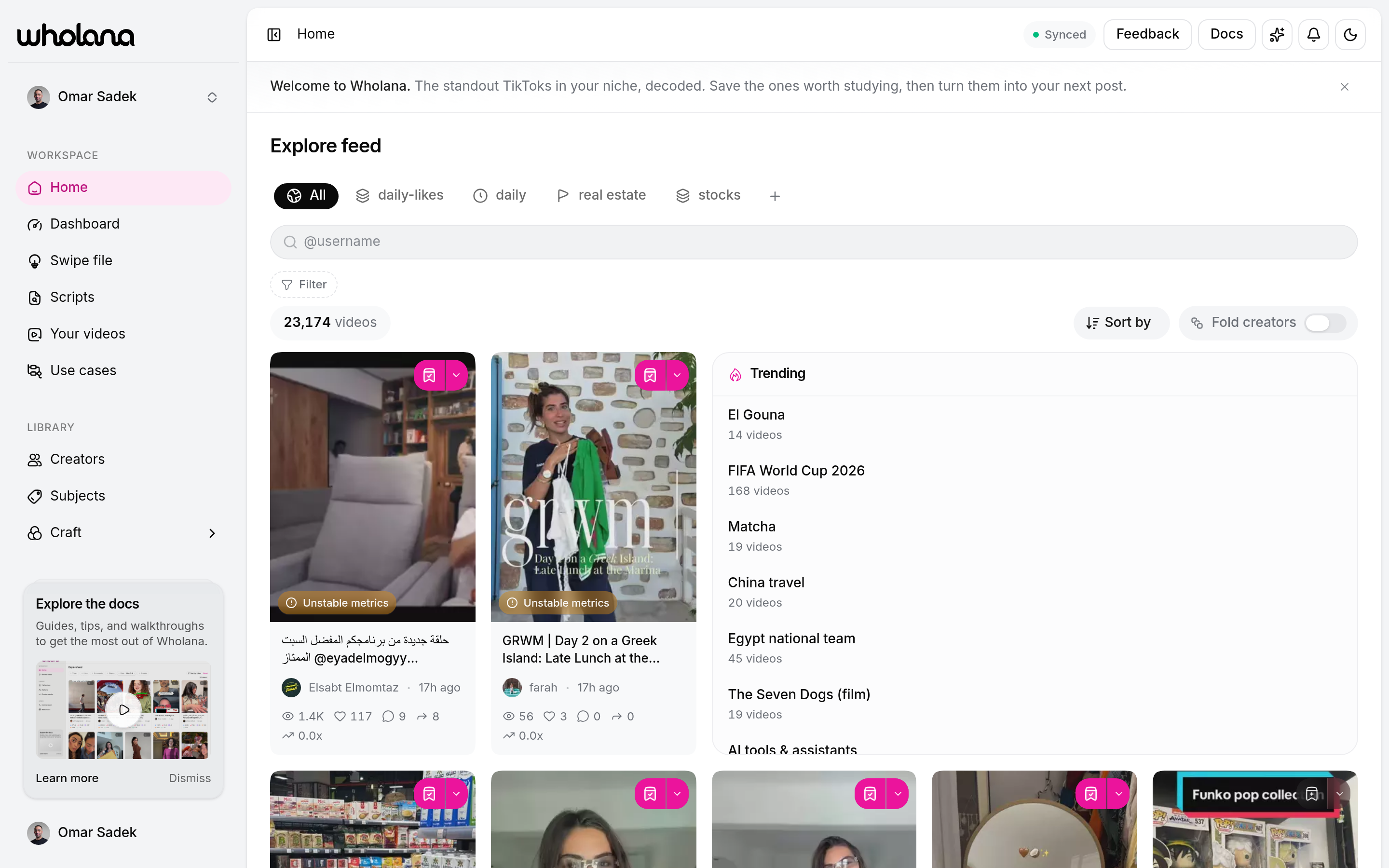 The Wholana Explore feed showing saved Lens tabs across the top, a Filter control, a Sort by control, and a grid of TikTok video cards each labelled with an outlier multiplier
