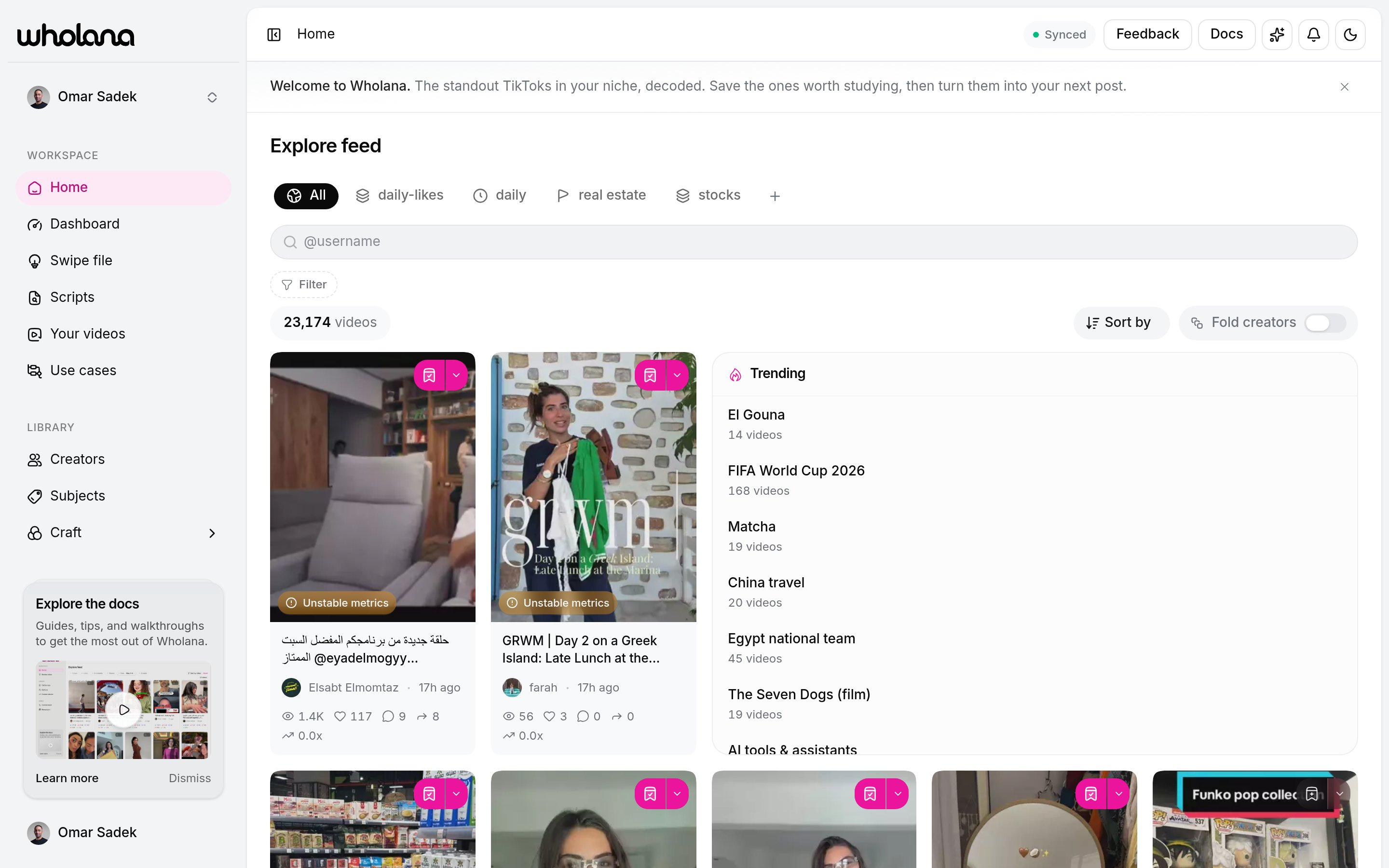 The Explore feed with lens tabs, the filter builder, the sort control, and a grid of video cards showing outlier scores