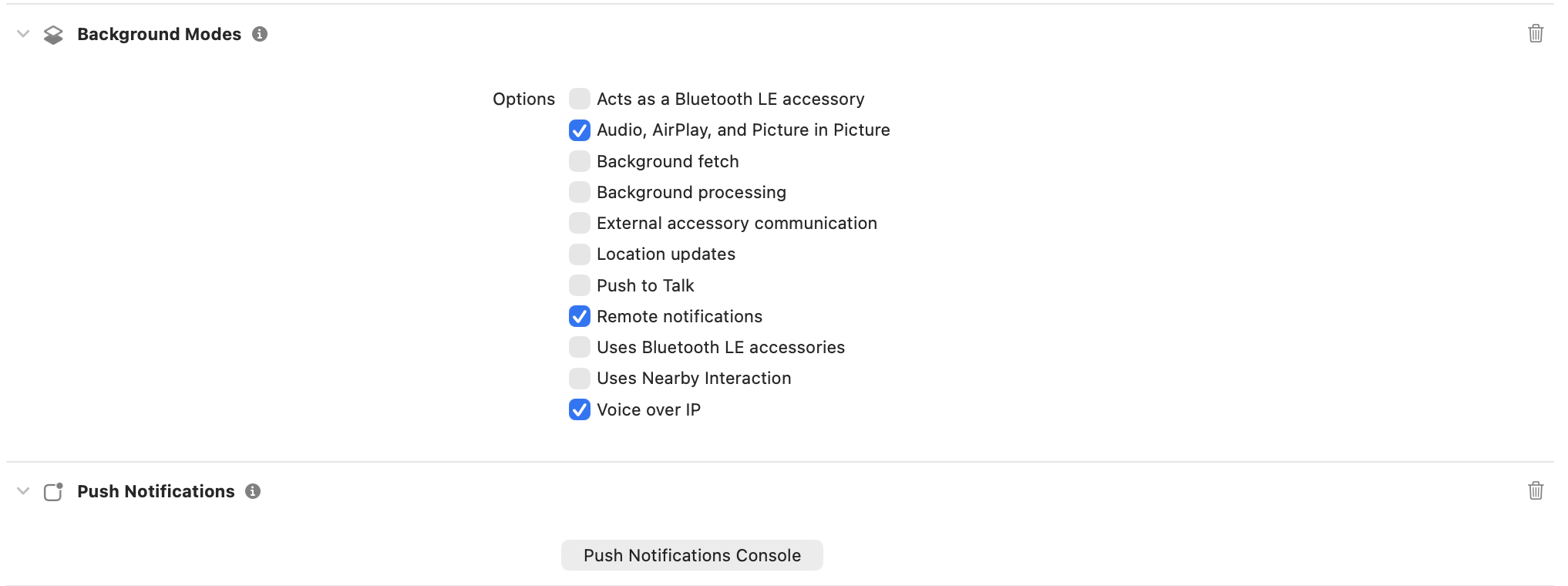 Enable Push Notifications and Background Modes for APNs