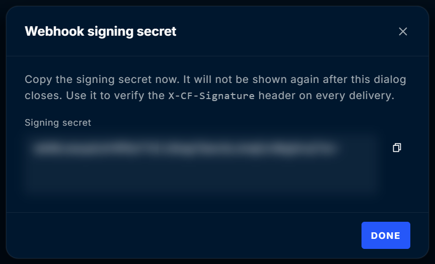 Webhook signing secret dialog with the secret value hidden, a copy button, and a Done button