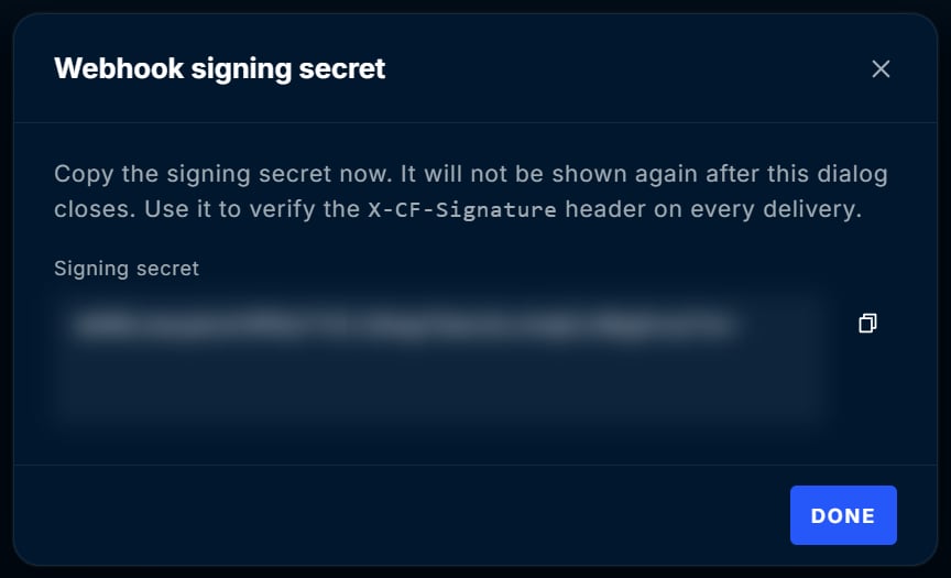 Webhook signing secret dialog with the secret value hidden, a copy button, and a Done button