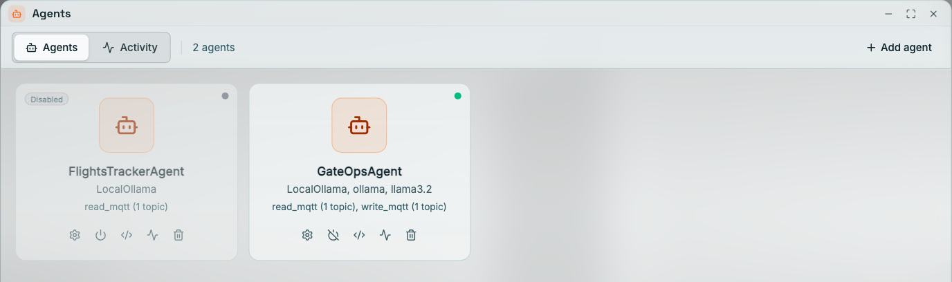 Coreflux HUB Agents window, Agents tab, 2 agents: the FlightsTrackerAgent card is dimmed with a Disabled pill and a grey status dot and shows LocalOllama and read_mqtt (1 topic); the GateOpsAgent card has a green status dot and shows LocalOllama, ollama, llama3.2 and read_mqtt (1 topic), write_mqtt (1 topic). Each card has Configure, power, LoT, activity, and remove icons