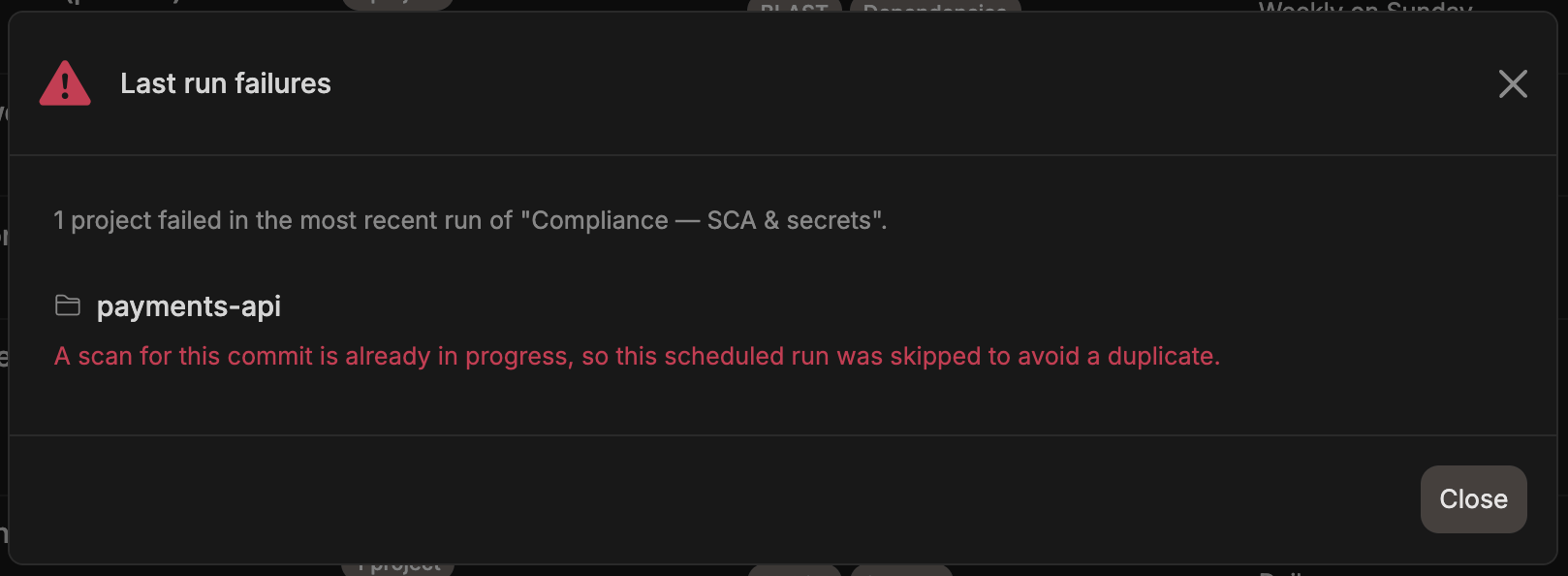Last run failures modal for a Retry outcome, explaining that a scan for the commit was already in progress so the scheduled run was skipped to avoid a duplicate
