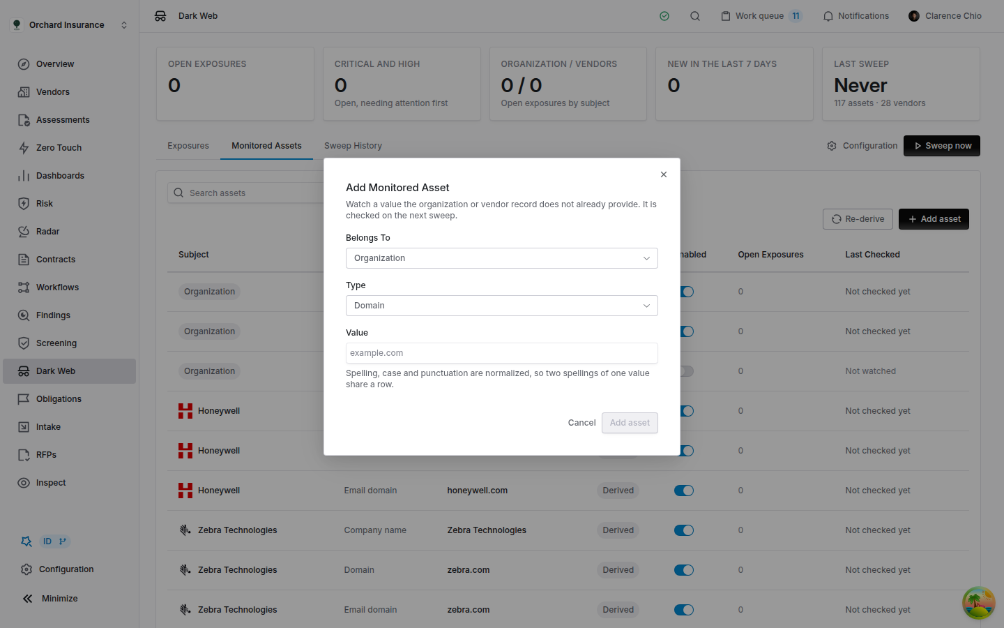 The Add Monitored Asset dialog with Belongs To set to Organization, Type set to Domain, an empty Value field with example.com as its placeholder, a note that spelling, case and punctuation are normalized, and the Cancel and Add asset buttons.