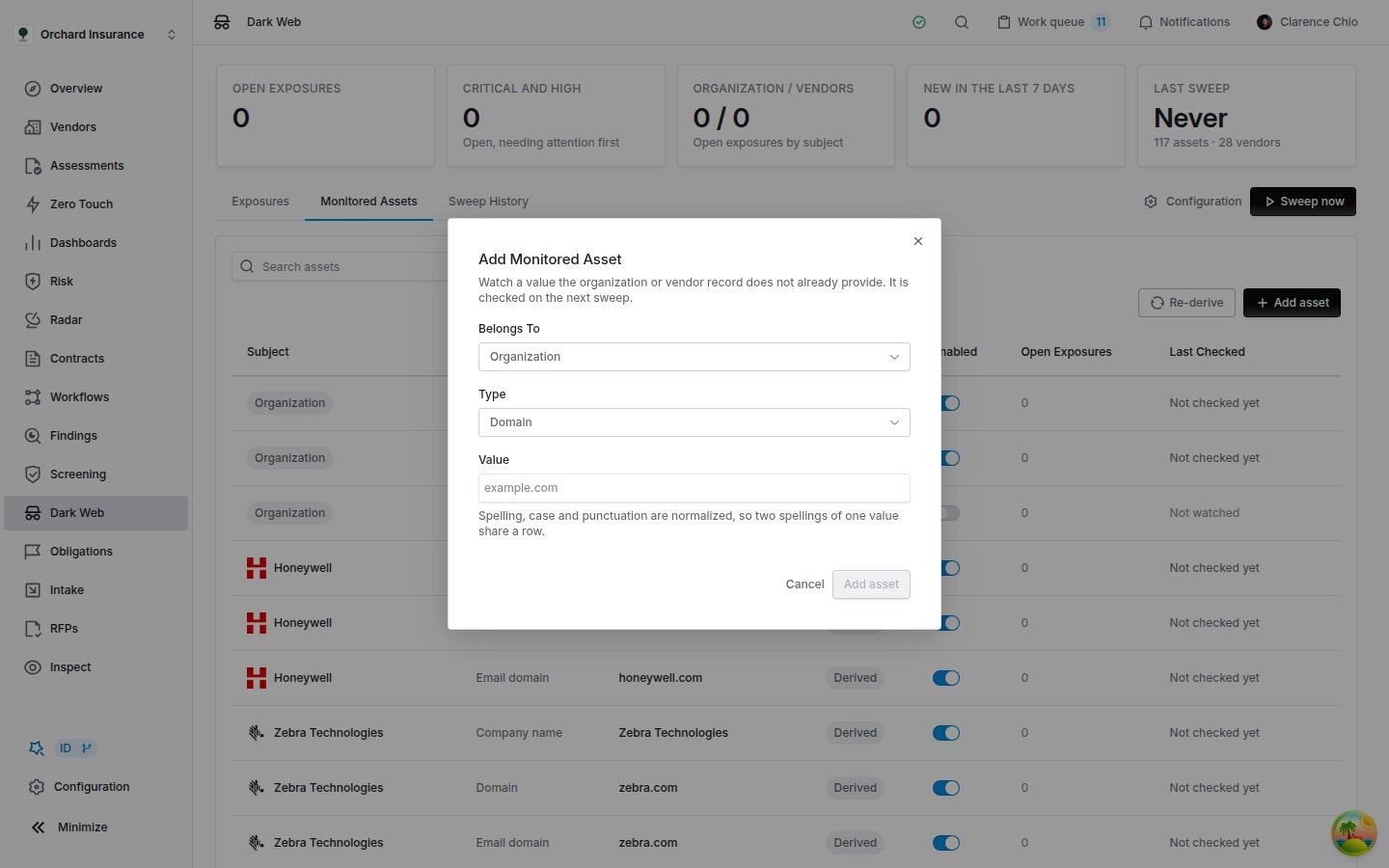 The Add Monitored Asset dialog with Belongs To set to Organization, Type set to Domain, an empty Value field with example.com as its placeholder, a note that spelling, case and punctuation are normalized, and the Cancel and Add asset buttons.