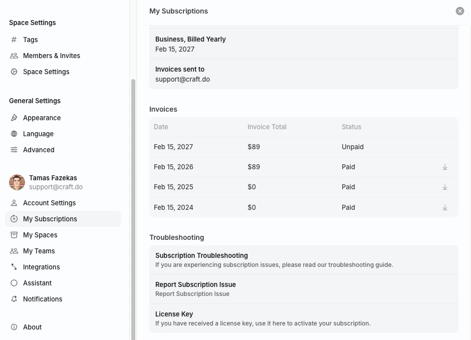 Invoices table with date, total, status, and download buttons