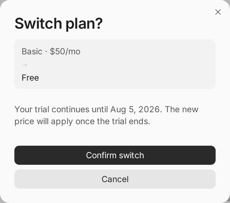A Switch plan? dialog showing Basic at $50 per month changing to Free, a note that the trial continues until August 5 2026, and Confirm switch and Cancel buttons