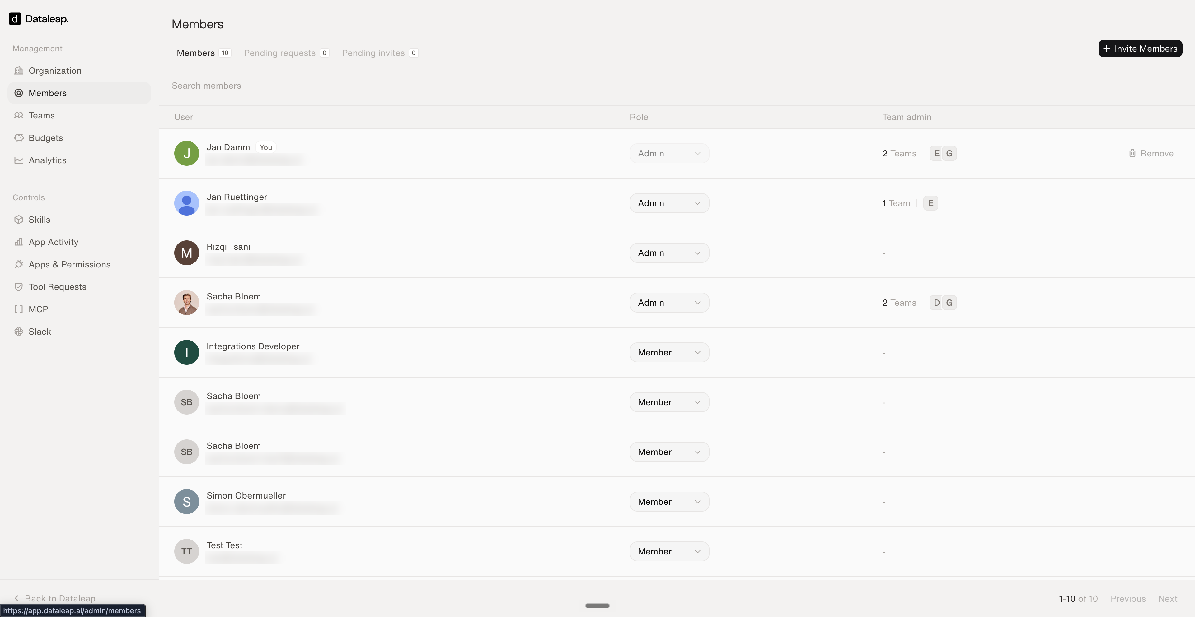 The Members page of the admin panel showing users with Admin or Member roles, team admin badges, and an Invite Members button