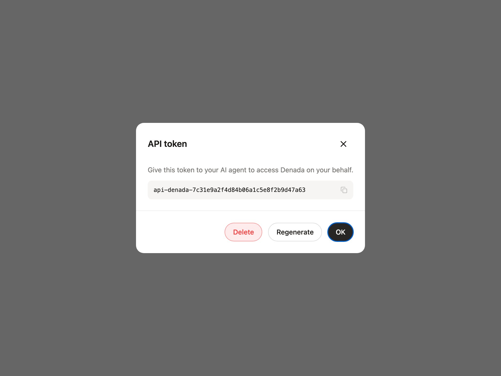 API token dialog showing a generated personal token with a copy control and Delete, Regenerate, and OK buttons