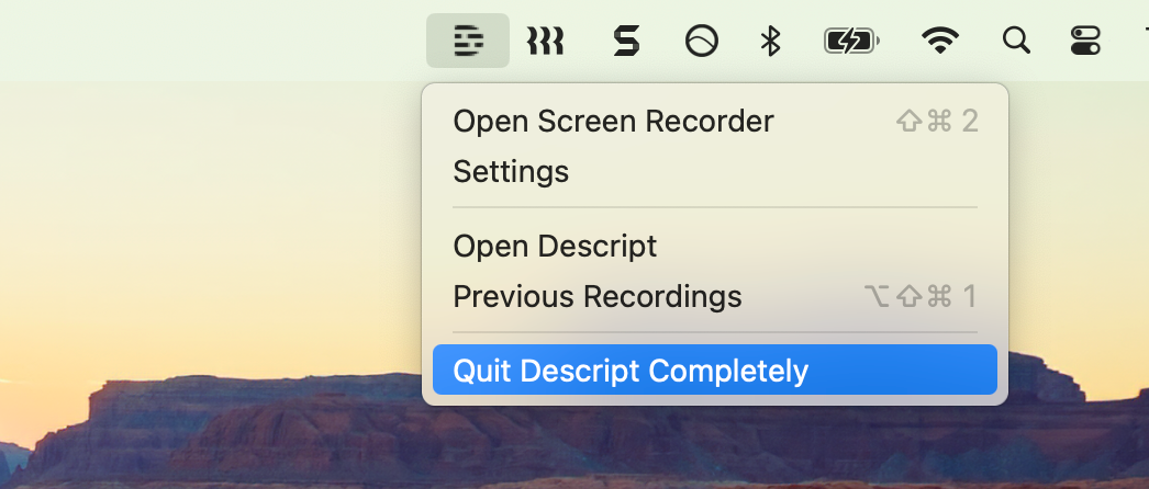 Quit Descript completely from the system tray menu. Press Esc to close.