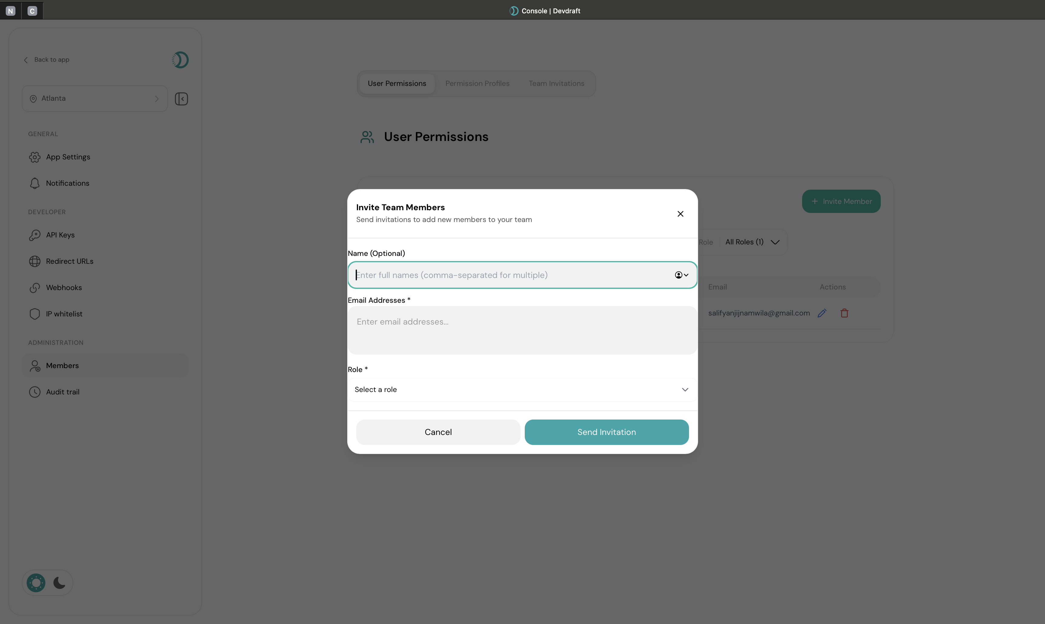 Invite team member interface with email and role selection - light mode