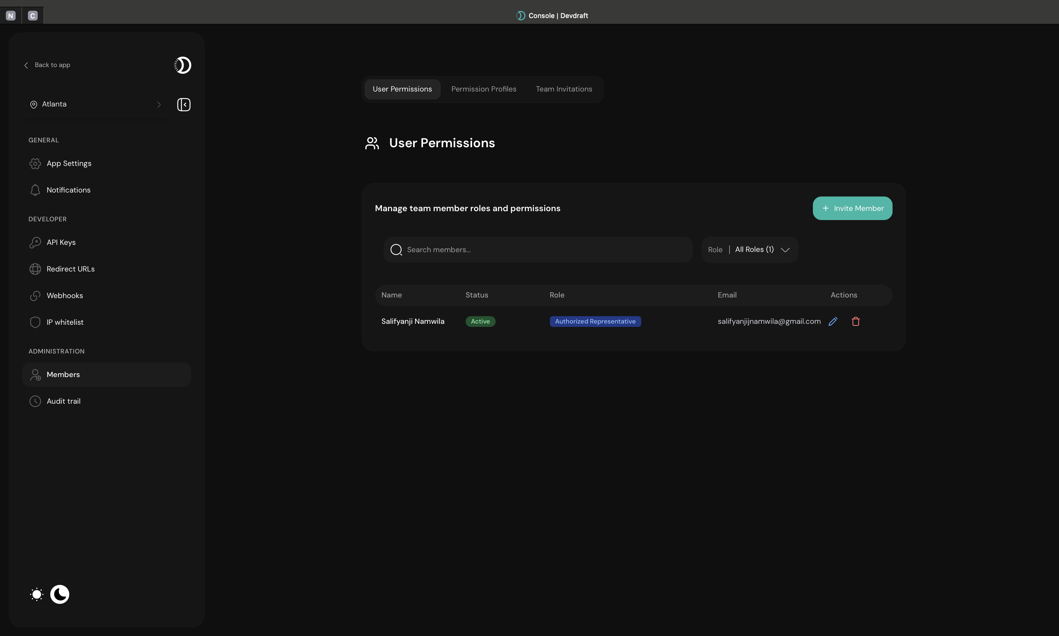 Team members overview showing names, roles, and status - dark mode