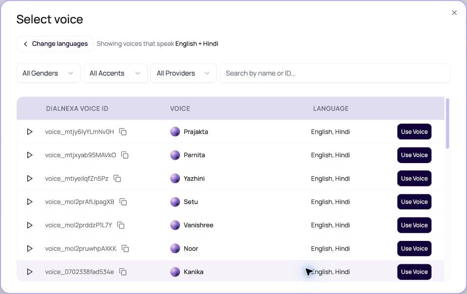 DialNexa Select voice dialog showing voices compatible with English and Hindi, provider, gender and accent filters, previews, and Use Voice buttons.