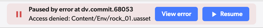 Workspace header reading Paused by error at dv.commit.68053 in red, with the error on the second line and View error and Resume buttons
