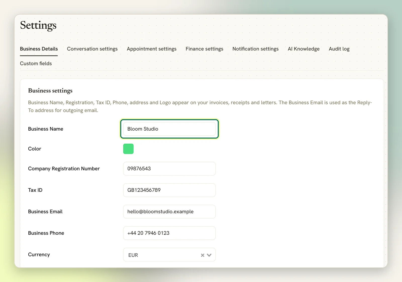 The Business Details tab of Settings with the Business Name field highlighted, above the registration number, tax ID, business email, phone and currency fields