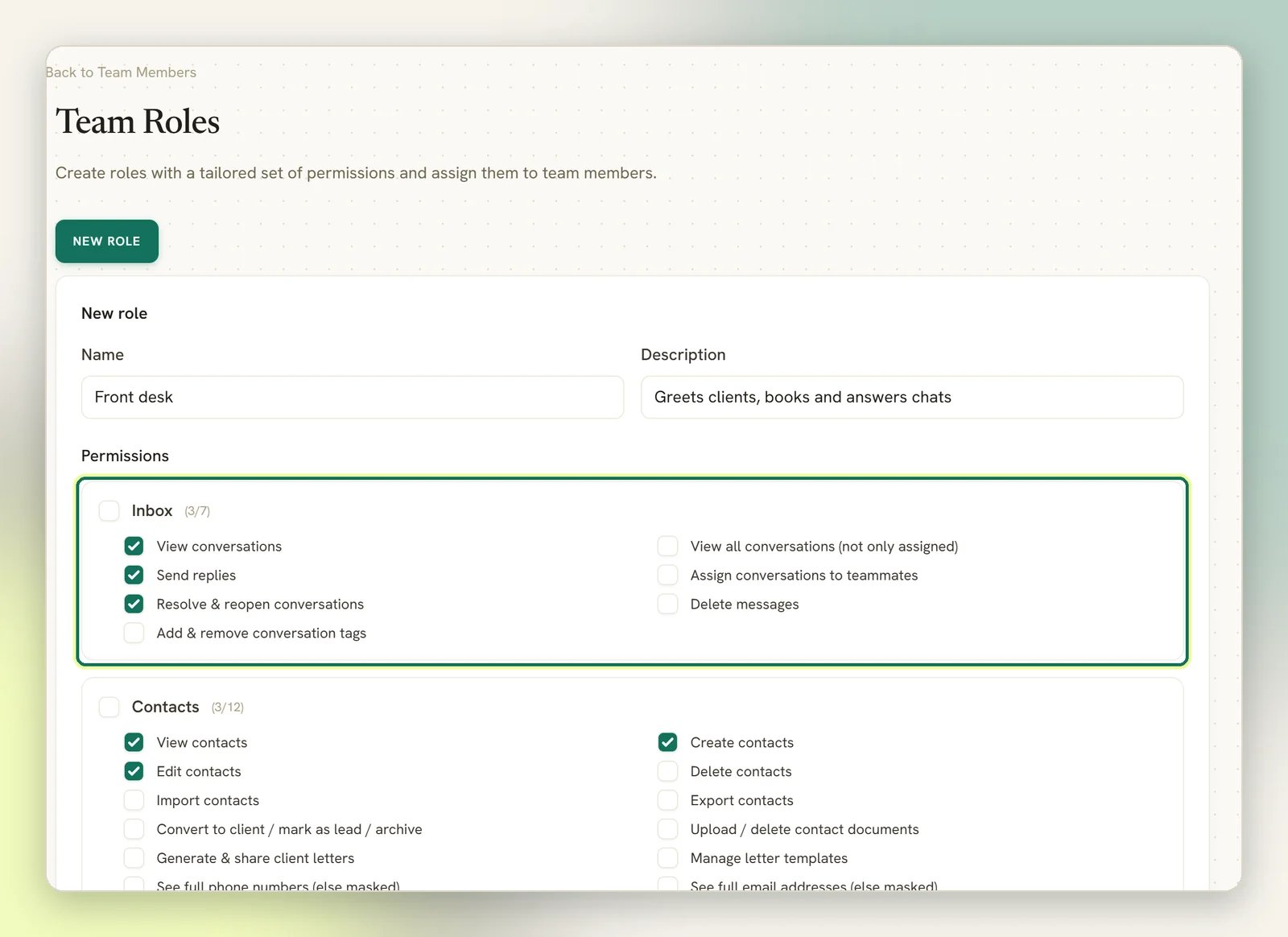 The New role form on Team Roles with the name Front desk and a description, and the Inbox permissions highlighted with three actions ticked